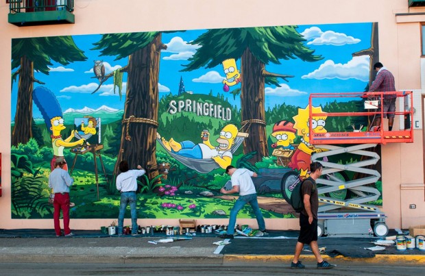 THE SIMPSONS:  Springfield, OR mural artists put the finishing touches on the new THE SIMPSONS mural celebrating THE SIMPSONS 25th ANNIVERSARY during the unveiling of the Simpsons mural dedication ceremony on the downtown walk of murals on Monday, Aug. 25th. THE SIMPSONS ª and © 2014 TCFFC ALL RIGHTS RESERVED.