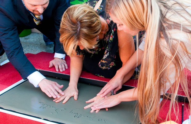 The new Simpsons mural is unveiled in a public ceremony in downtown Springfield Oregon on August 25th, 2014. In attendance were city dignitaries, the general public, and the voice of Lisa Simpson, Yeardley Smith.