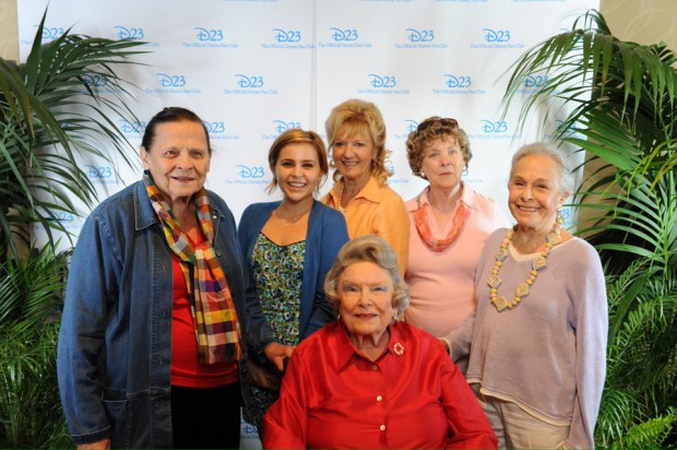 Ginni Mack (in red), surrounded by the “Tink Ladies”: Alice Davis (wife of character creator Marc), Mae Whitman (current voice of Tinkerbell), Kathryn Beaumont and Margaret Kerry (live-action reference models for Tink) and Marge Champion (reference model for Pinocchio’s Blue Fairy). © Disney, courtesy D23 2012