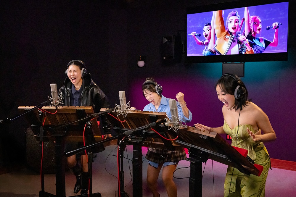 (R-L) Ji-young Yoo (Zoey), Arden Cho (Rumi) and May Hong (Mira),. [Photo by Ricky Middlesworth. ©2025 Netflix]