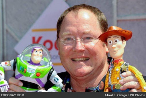 John Lasseter poses with Buzz and Woody.